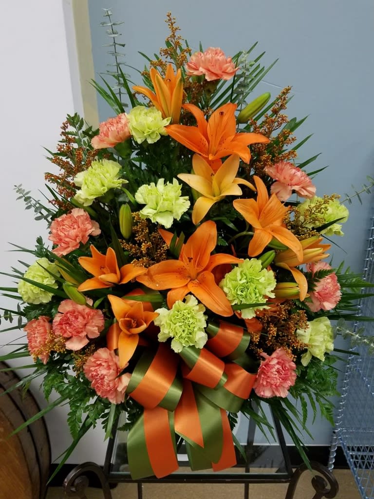 Jonsie - Orange and greens sympathy basket 