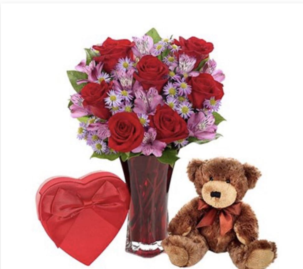 SAY IT WITH LOVE BUNDLE - Convey your thoughts of true love so perfectly, so exquisitely, with this unforgettable arrangement boasting stately red roses, purple Monte Casino blooms and purple alstroemeria in a graceful red vase.