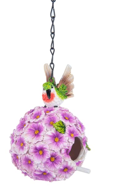Hanging birdhouse covered in purple flowers with a small bird on top