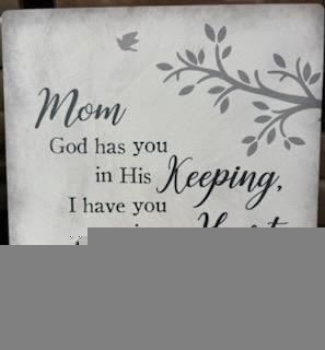 Decorative sign with a condolence message for Mom