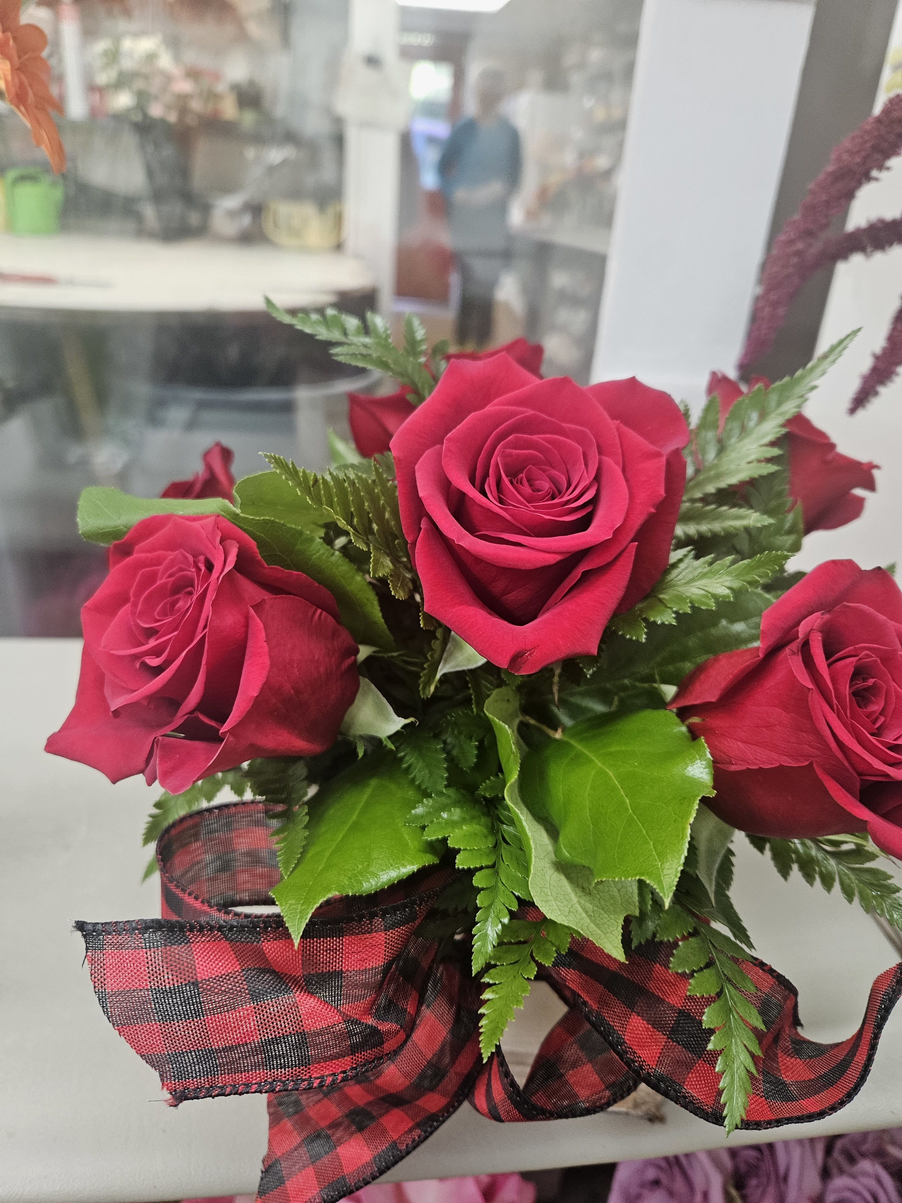 Box of Red Roses! - Square box of red roses topped off with a red/black buffalo print ribbon.  Box may be white or gray!!  Checked ribbon may vary Order 24/7 Delivery Mon -Fri only