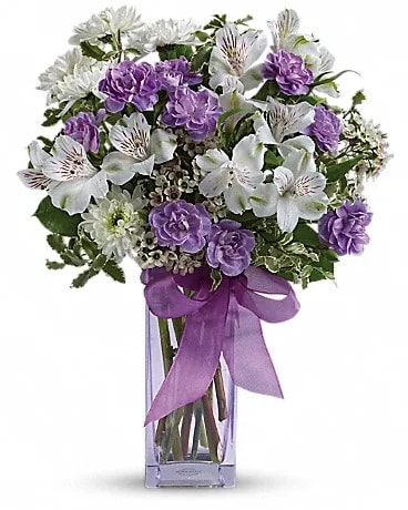 Teleflora's Lavender Laughter Bouquet - Fill her heart with laughter! The ultimate lavender-lover's bouquet this gleeful gift of white and lavender blooms is delivered in a pretty pale lavender vase she'll cherish forever. Lavender organza ribbon adds that gifting touch.