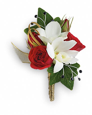 Red and white floral boutonniere with green leaves and gold ribbon
