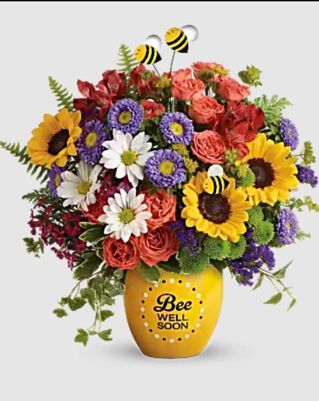 Mixed bouquet in a yellow vase with a Bee Well Soon message
