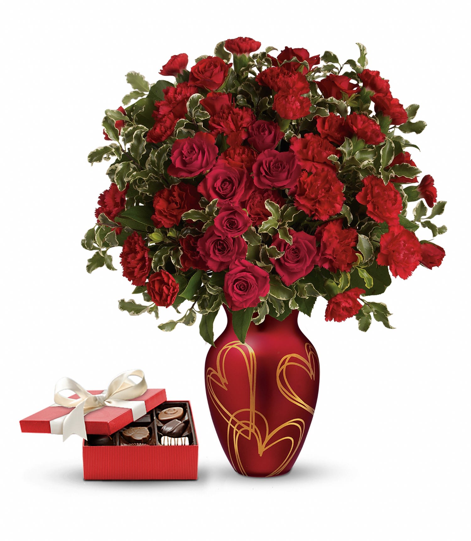 Hearts Of Gold Gift Set DX - This sweet gift set includes a delicious box of chocolates paired with a stunning bouquet. Golden hearts and red roses are the perfect recipe for Valentine's Day bliss! Surprise someone special with this delicate arrangement of red roses and carnations, hand-delivered in a rich red vase with gorgeous satin finish, adorned with golden hearts and a box of chocolates! 