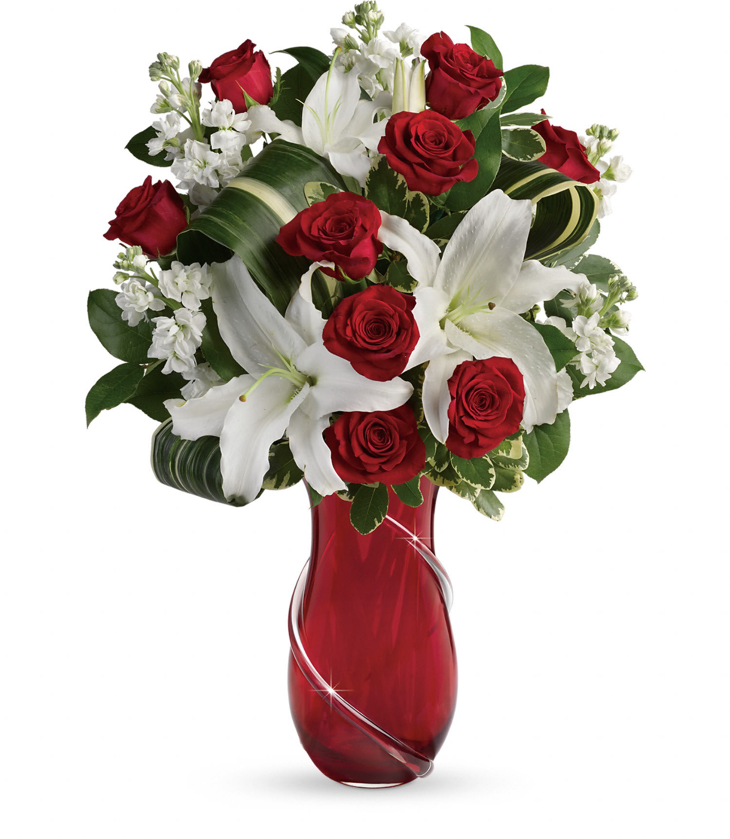 Teleflora's Love And Tenderness Bouquet PM - Romantic red roses and pure white lilies are the ultimate show of love and tenderness this Valentine's Day. Artfully arranged in a showstopping art glass vase with hand-applied glass ribbon, this luxurious gift will warm her heart for years to come. 