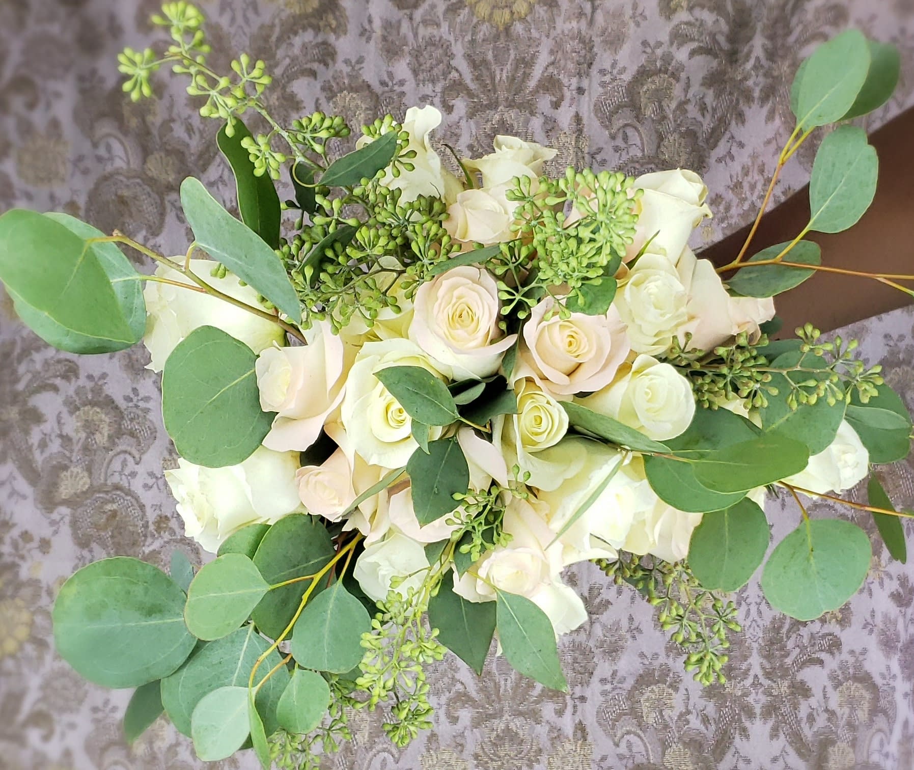 Bouquet of white roses with eucalyptus greenery
