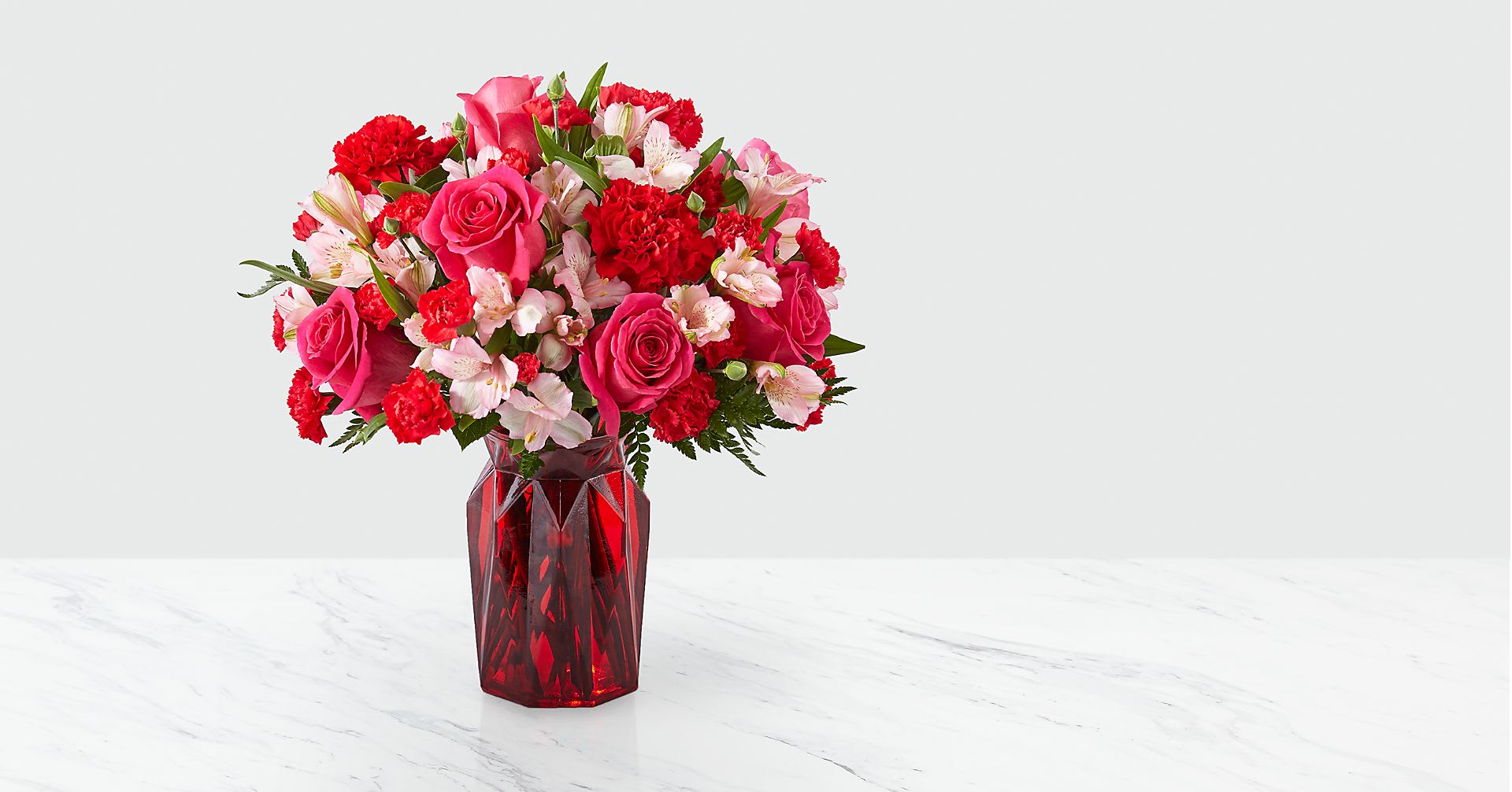 Adore You - Fall in love at first sight with our Adore You™ Bouquet. Beautifully designed with hot pink roses, red carnations and pink alstroemeria, this flower arrangement is sure to have them blushing all Valentine's Day long!