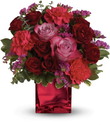 Ruby Rapture Bouquet -   Pure passion. Bedazzle your beloved with luscious red and lavender roses in our stunning red mirrored glass cube. What a dramatic reflection of your affection!  Includes red and lavender roses, hot pink carnations and assorted fresh greens. 