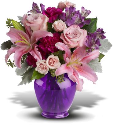 Pink lilies and roses in a purple vase