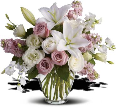 Bouquet of pink and white flowers in a clear glass vase