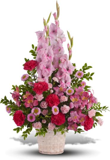 Pink and red floral arrangement in a white basket