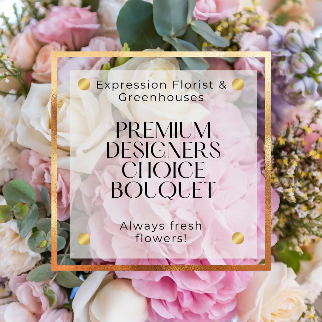 Premium Designers Choice - Luxurious Floral Arrangement Designed using an assortment of our most exquisite flowers in a traditional Spring color palette.