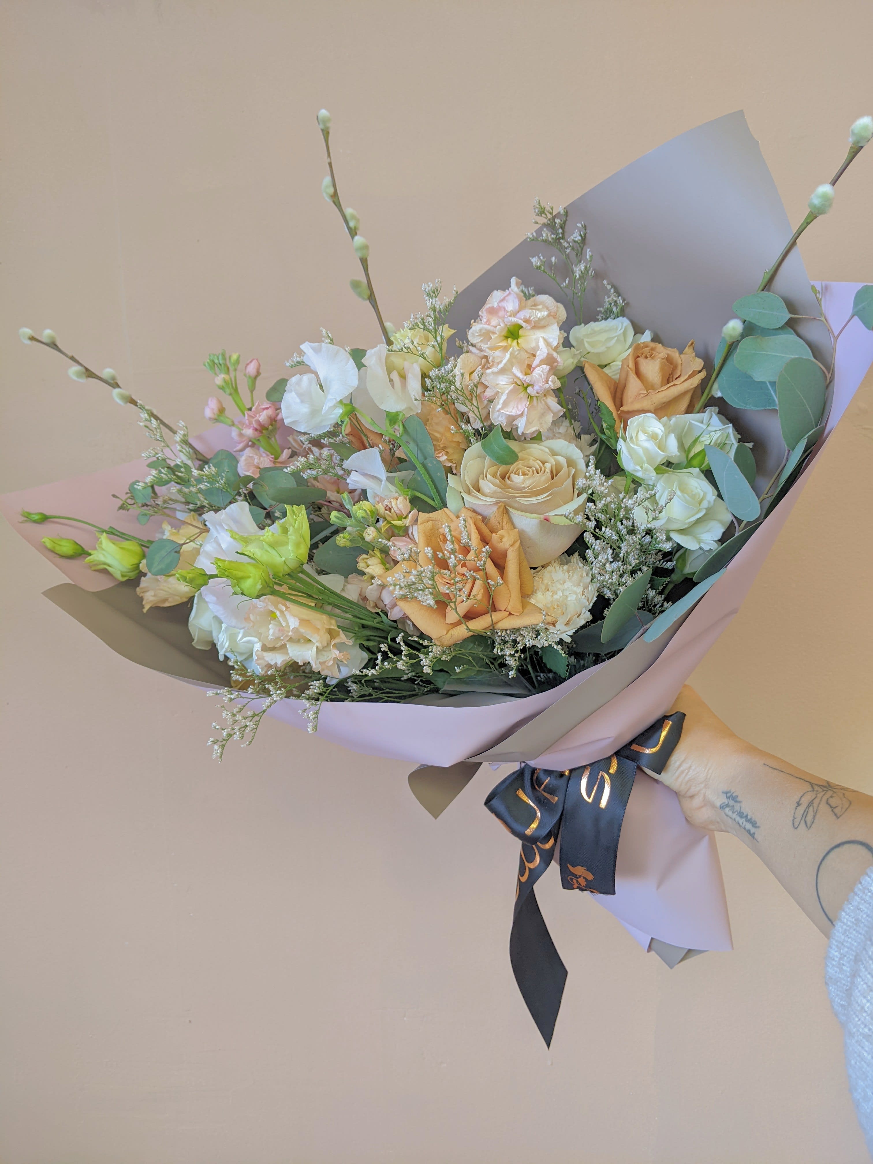 Premium Hand Tied Bouquet- Pastel&amp;Neutrals - A bouquet of soft tones and neutral colors wrapped in our premium wrapping paper to give it extra sweetness. In case of flower unavailability, it will be a designer's choice with the same color palette.