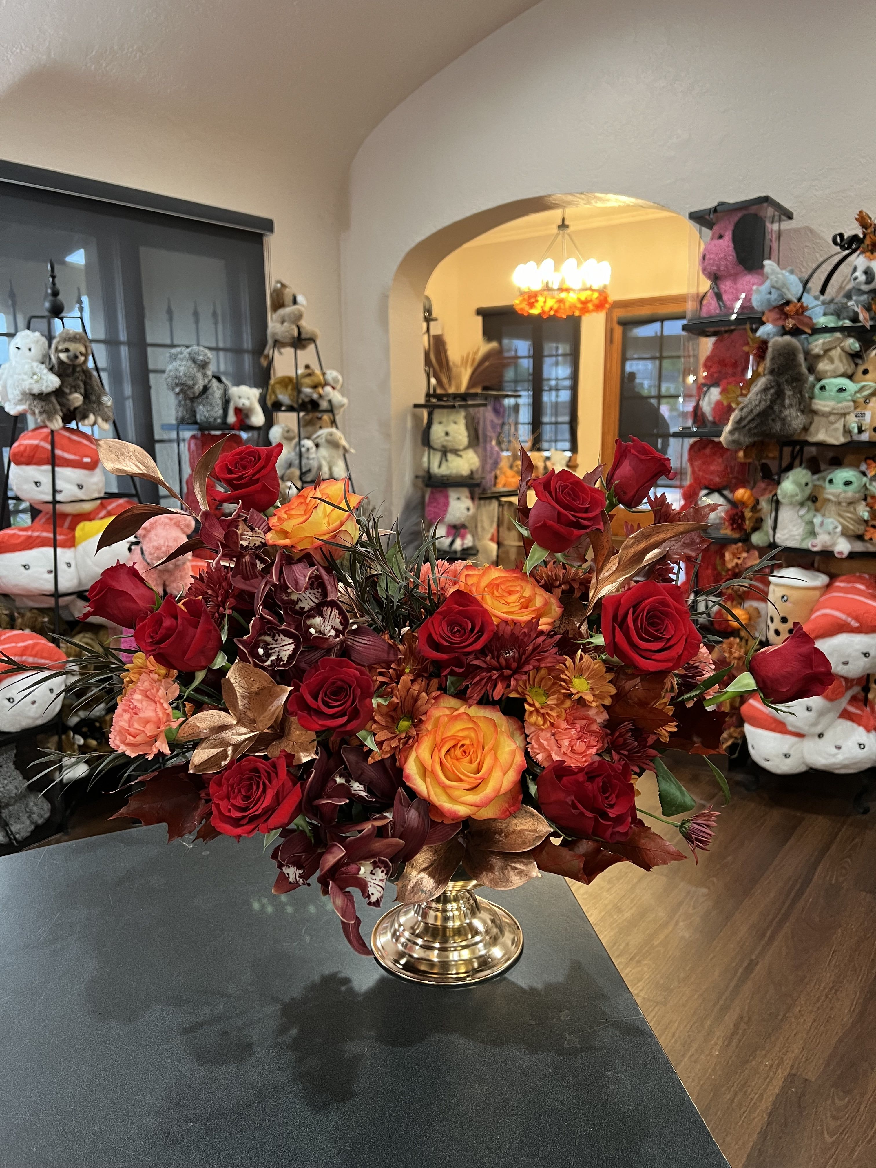 Grateful Heart - Warm flowers in copper, orange, and red tone arranged in a copper container. A perfect Thanksgiving gift for this holiday season. 