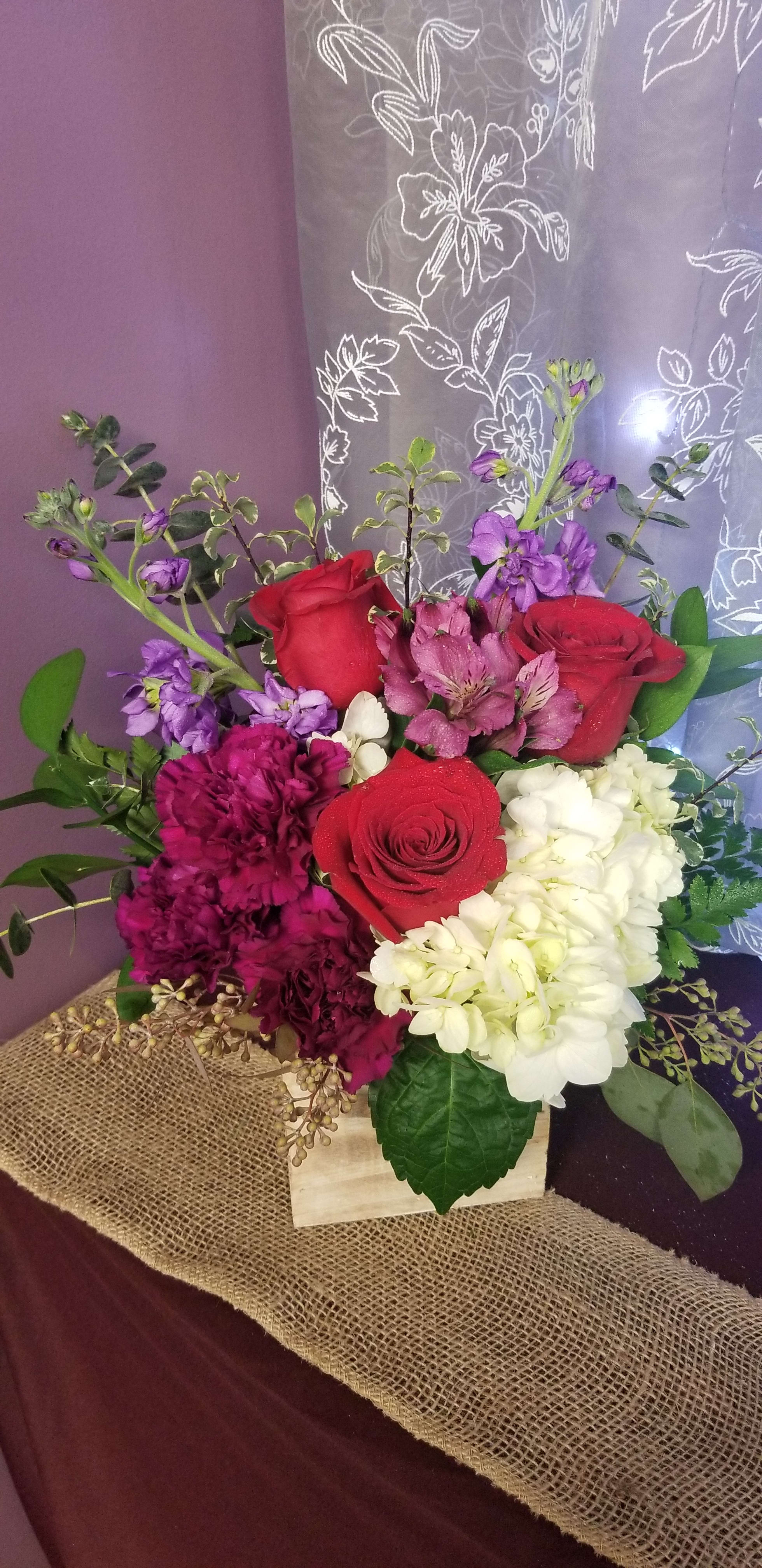 All My Kisses by MG Florist  - Designed in a wooden cube with a hydrangea roses, stock, alstroemeria, and carnations.