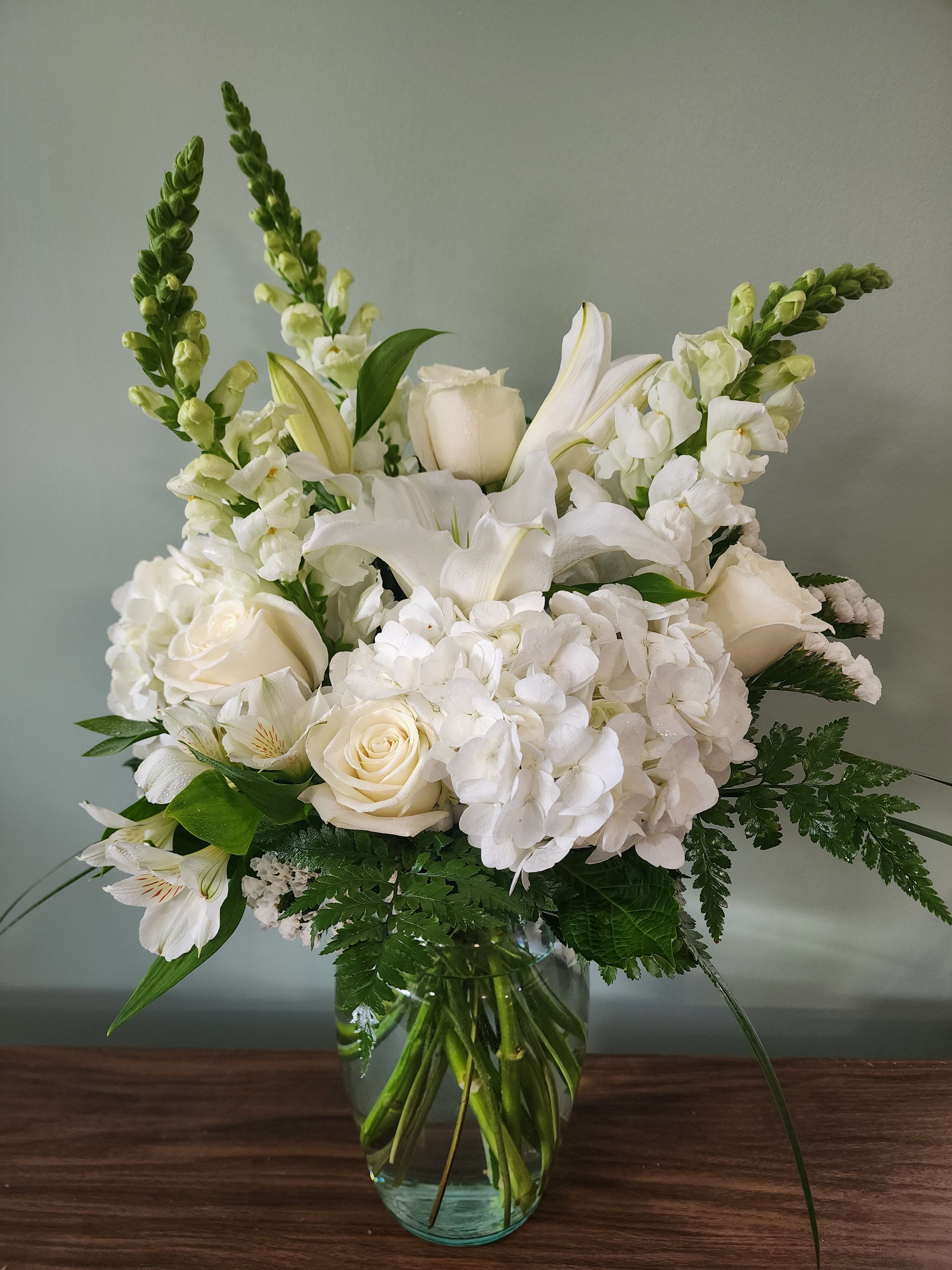 White floral bouquet in a clear glass vase