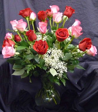 Bouquet of red and pink roses in a glass vase