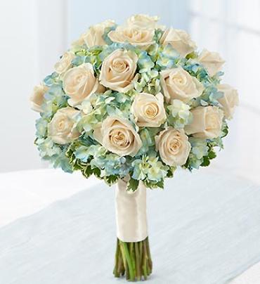 Cream rose bouquet with pale blue flowers and wrapped stems