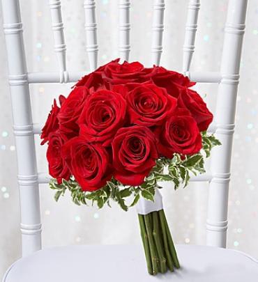 Bouquet of red roses with variegated greenery