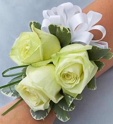 White rose wrist corsage with ribbon bow