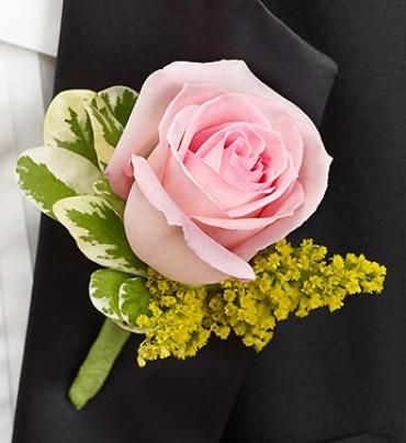 Pink rose boutonniere with variegated greenery and yellow filler