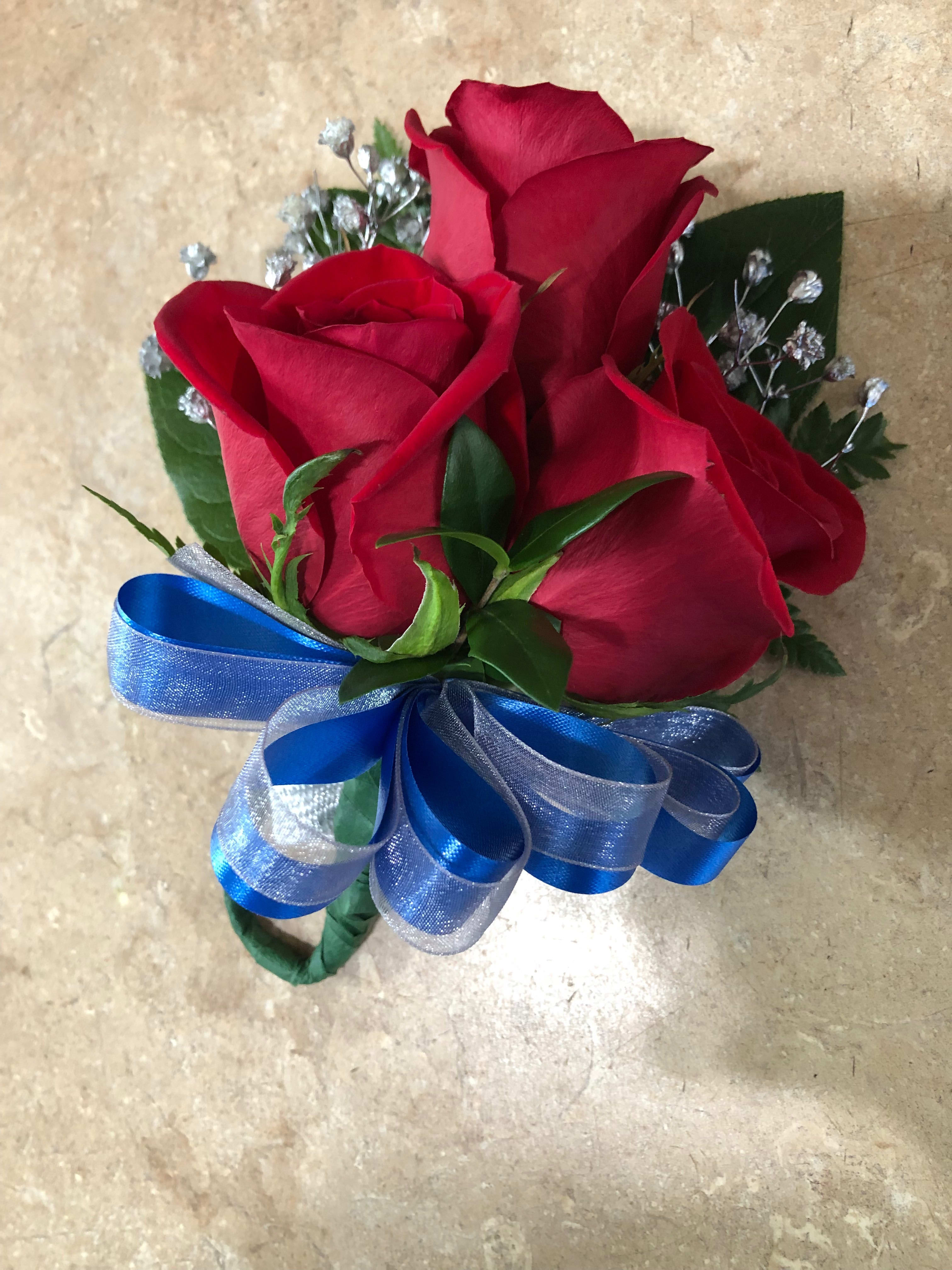 Bouquet of red roses with a blue ribbon bow
