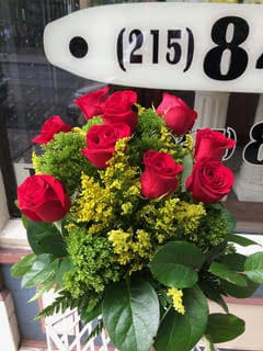 Bouquet of red roses with yellow filler flowers