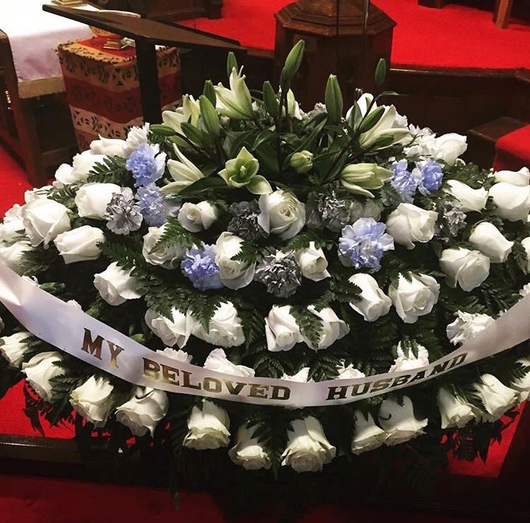 4 J , Full casket spray - This Full casket spray is the center flower aragement for a funeral service.