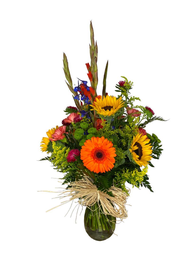 Classic Expression - This charming arrangement,  features Gladiolas, Sunflowers, Mini Carnations, Aster Flower, Aster flowers, Delphiniums and solidaster flowers, 