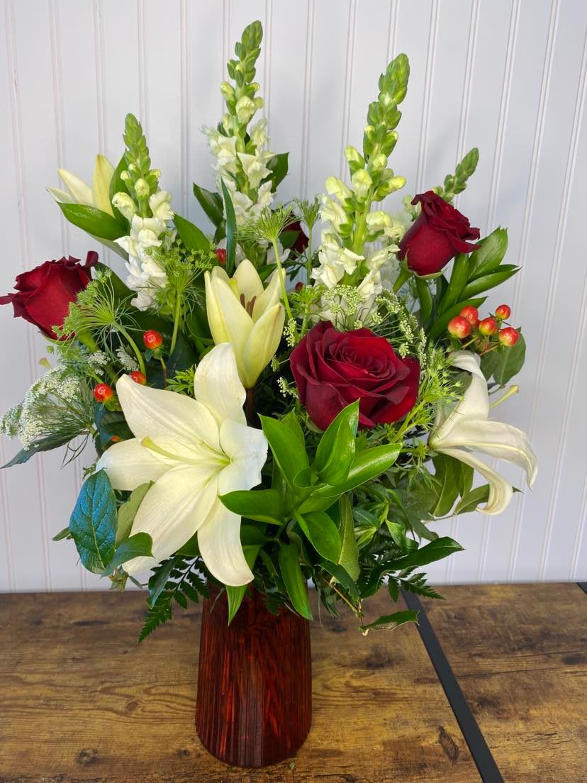 My Love Bouquet - Show your love one how much you love them with this delightful arraignment, it features snap dragon flowers, white lilies, red roses and some berries complimented with the following fillers Queen  Ann's lace