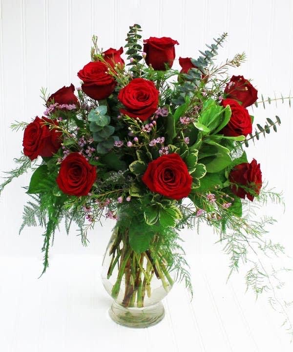 Roses Are  Red - 1 Dozen roses arranged with accent filler - This arrangement is available in red, pink, white, lavender, peach, orange, and yellow.  Please specify in "Special Instructions" your choice of color.  If no color is selected designer will choose a beautiful color.