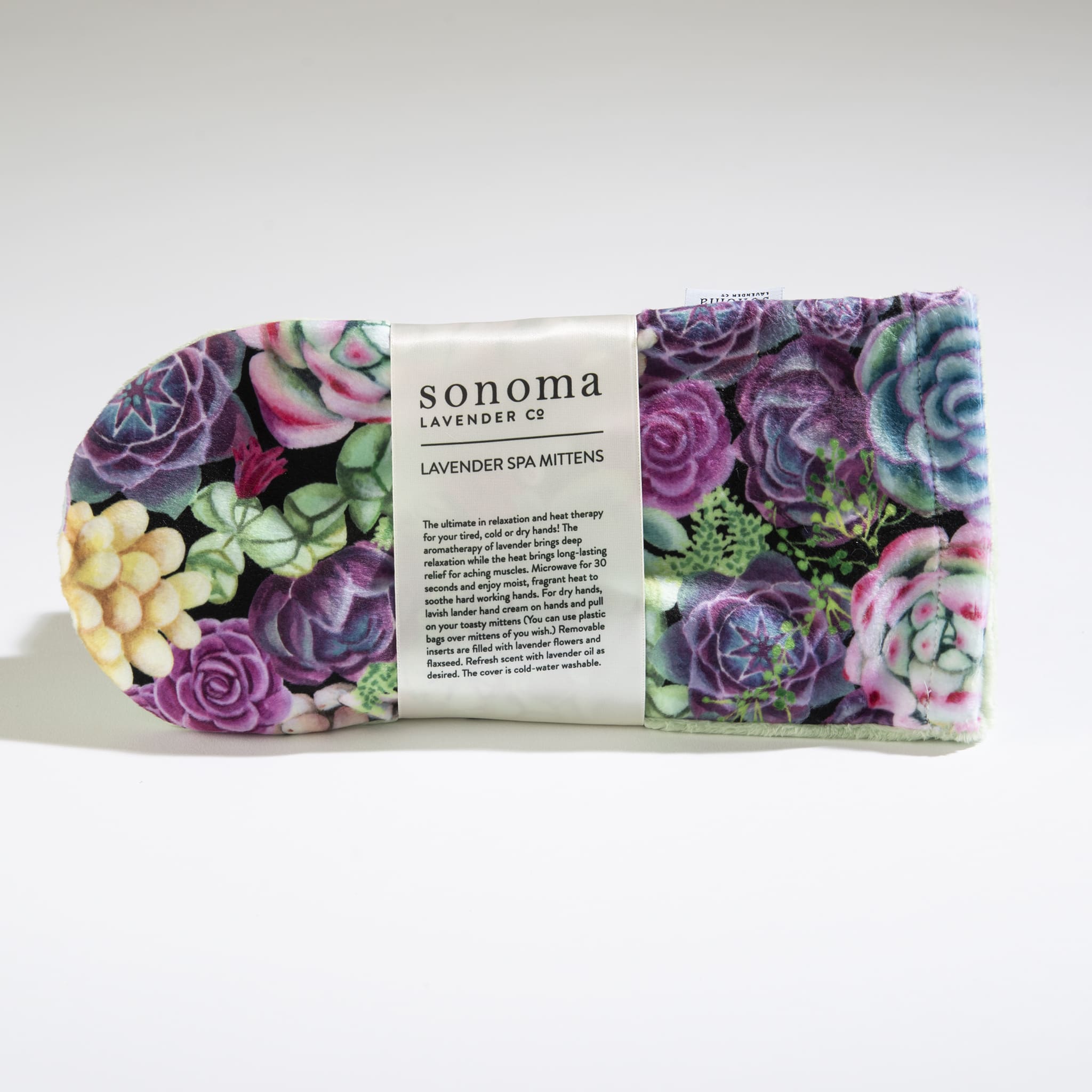 Pair of lavender spa mittens with colorful succulent pattern and product label