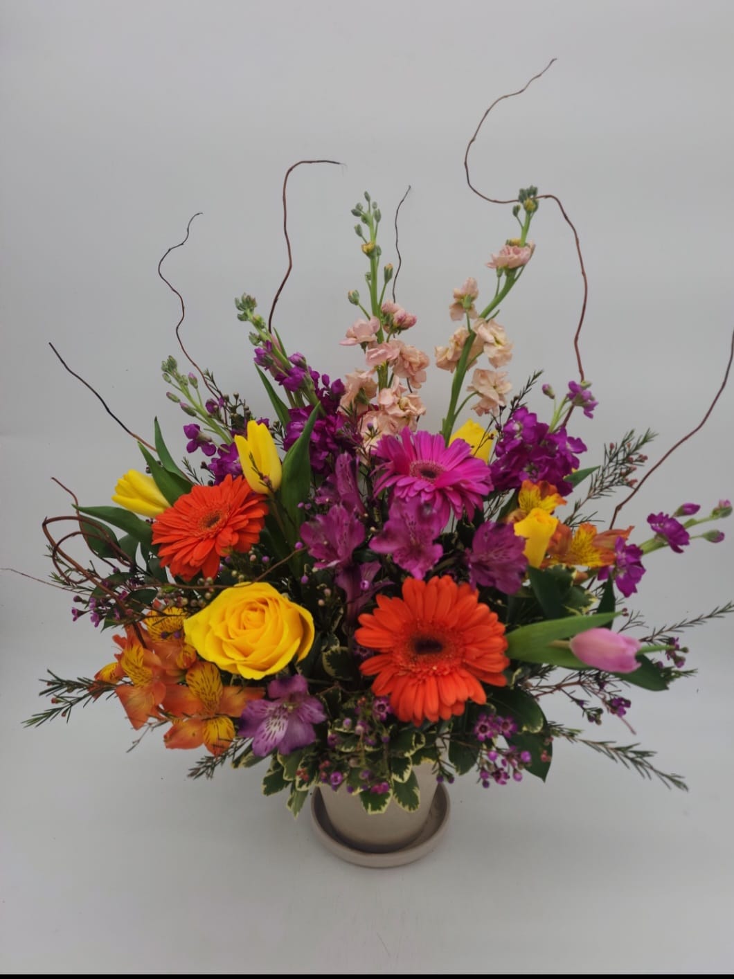 Glorious Grace - Celebrate the spirit of a loved one who is no longer with us with a gorgeous array of roses, lilies and other favorites. 