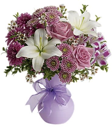 Teleflora's Precious in Purple - If you want to impress someone send elegant flowers in a soft lavender vase accented with a lavender ribbon. Warm rich dramatic it's the kind of gift that says "You're special. And so am I."