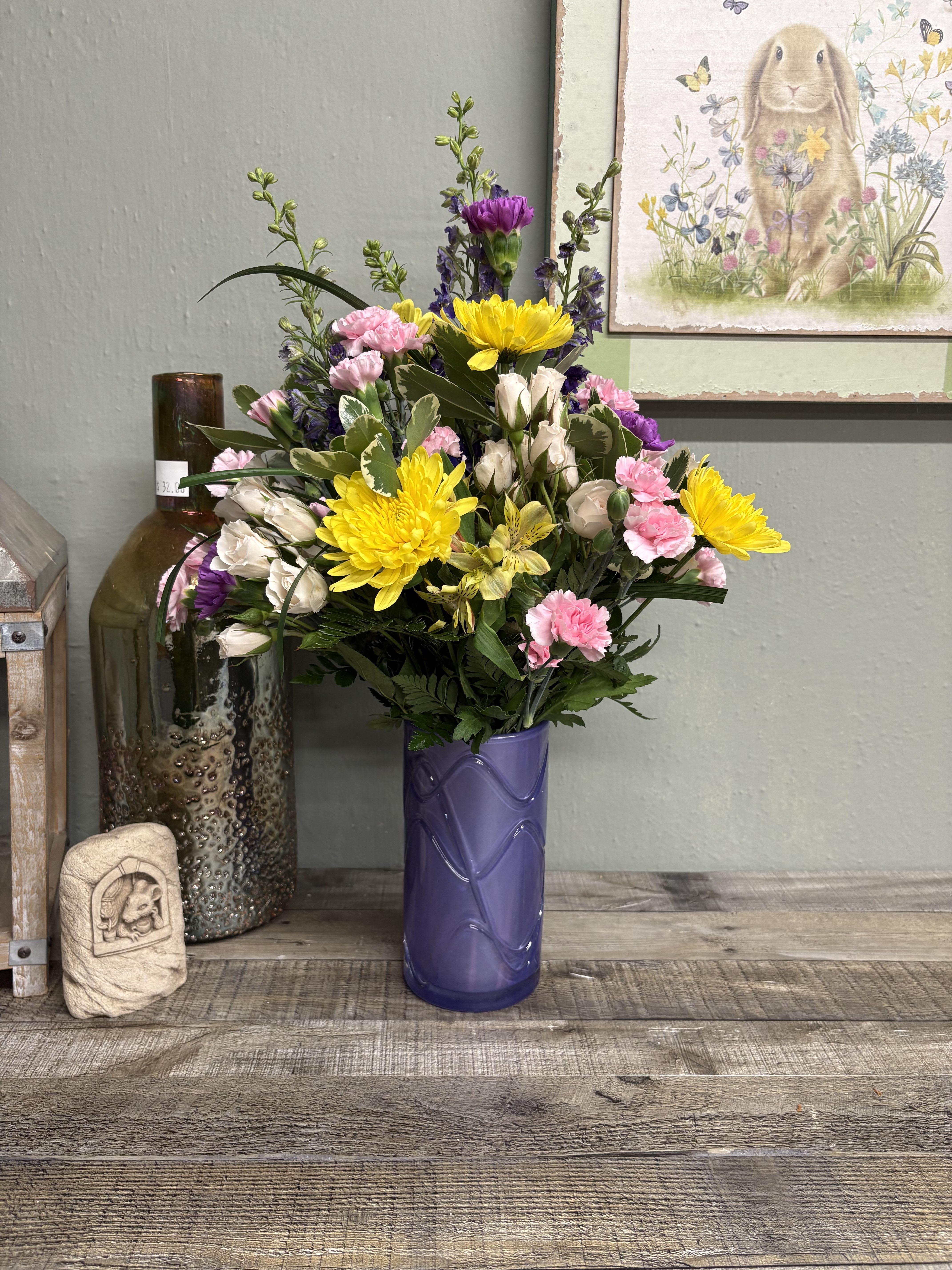 Pretty Daydream Bouquet  - Celebrate her sweetest moments with Teleflora's Pretty Daydream Bouquet, a dreamy mix of soft, vibrant blooms beautifully arranged in Teleflora's Pretty Daydream Vase-a charming keepsake she'll enjoy long after Mother's Day. Teleflora's Pretty Daydream Bouquet features a designers choice of flowers and colors. Roses, mums, carnations and other blooms accented with filler and salal, delivered in Teleflora's Pretty Daydream Vase. Orientation: All-Around 