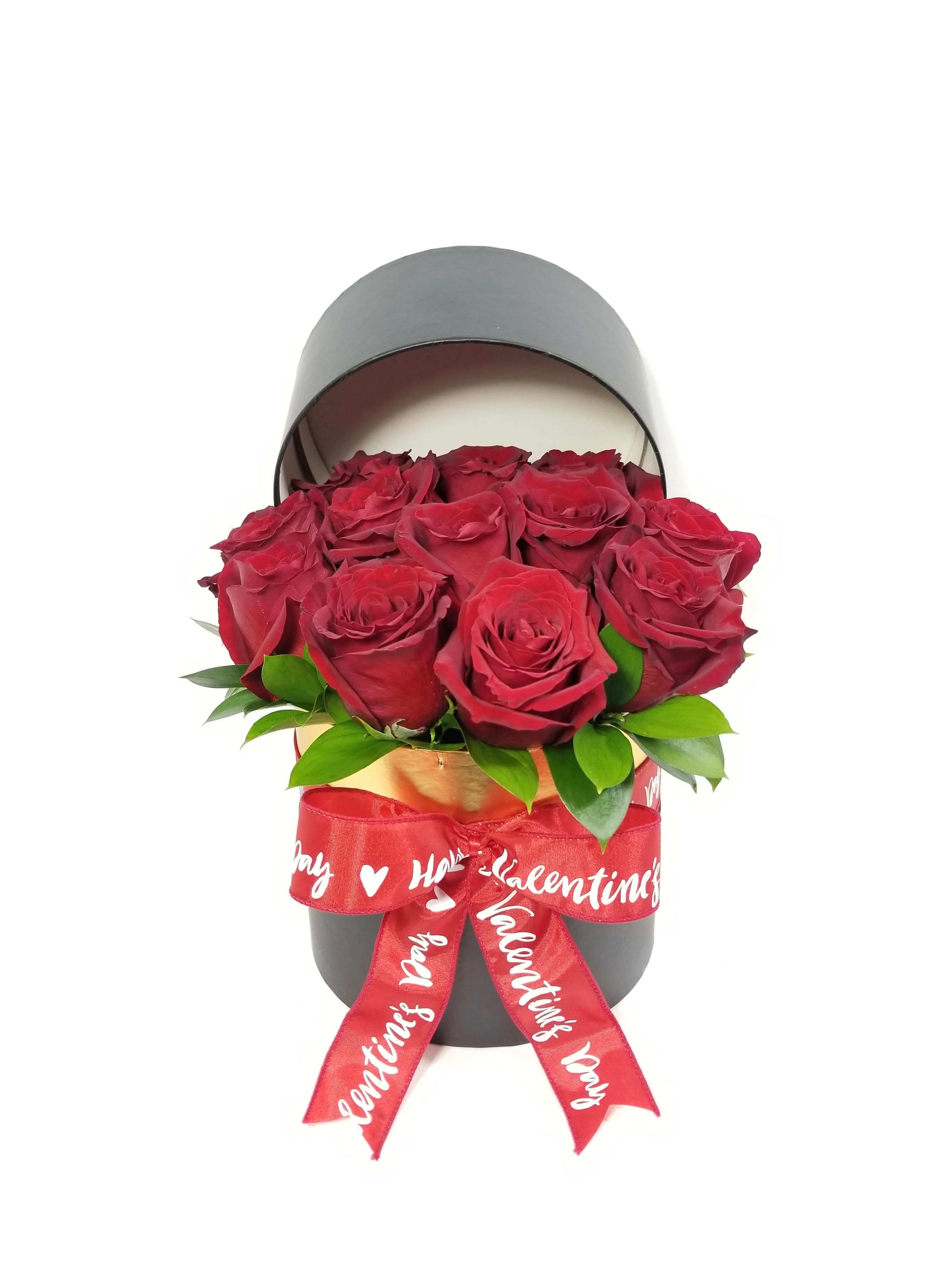 Red roses in a black hatbox with a red Valentine ribbon