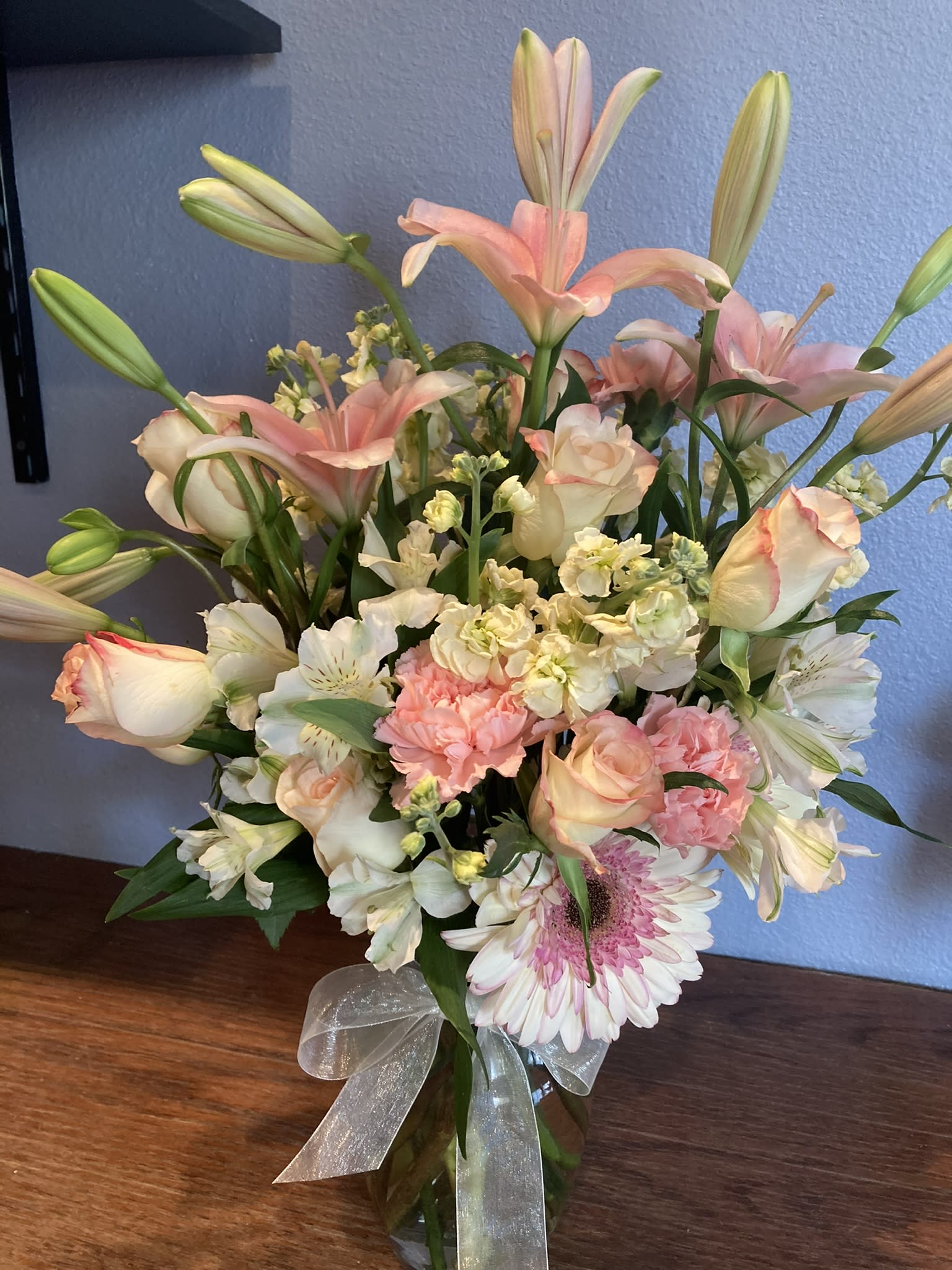 Timeless Beauty - Mix the timeless beauty of pink roses and pink lilies with cream stock and white alstromeria, blended among pink gerbera daisies and carnations. 
