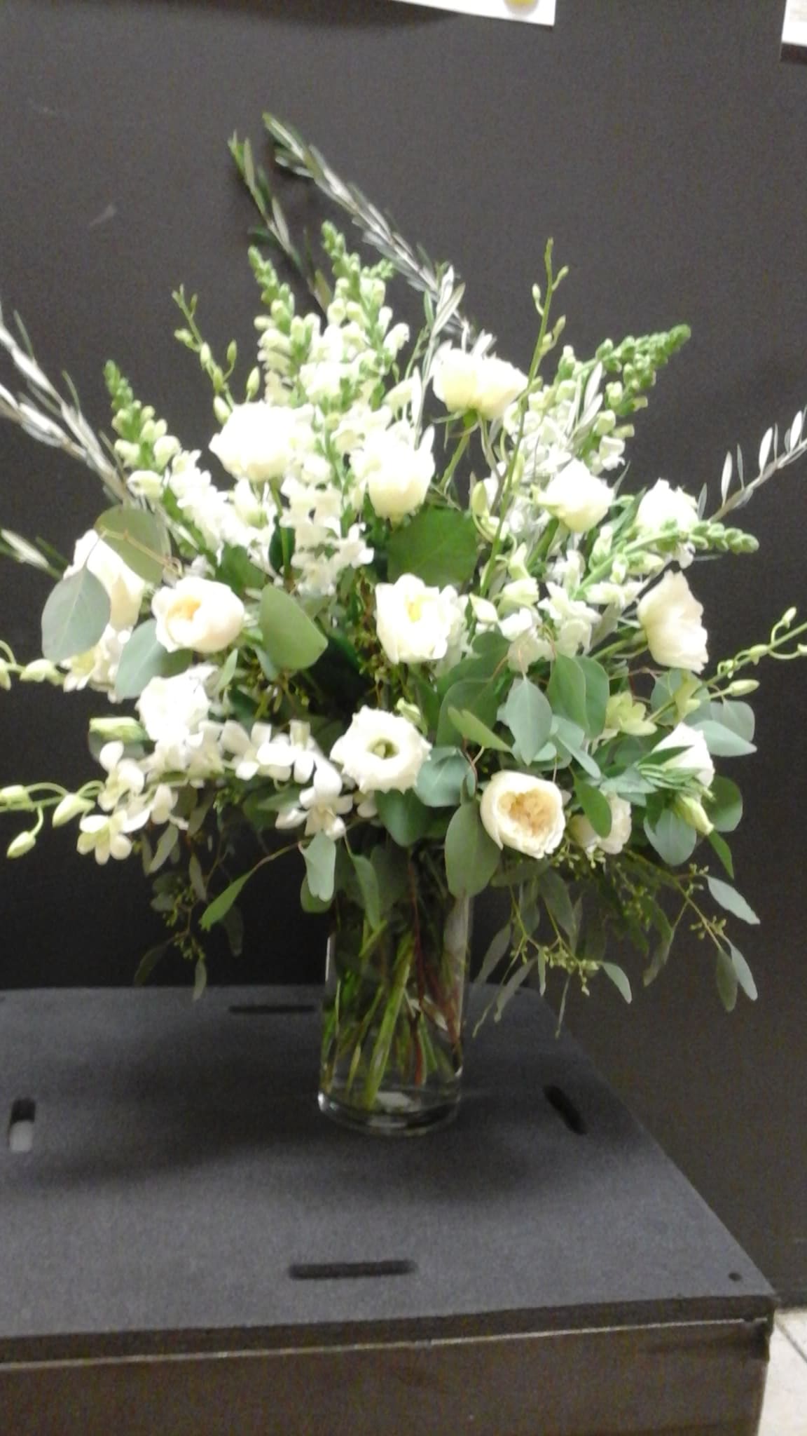 White floral arrangement in a clear glass vase