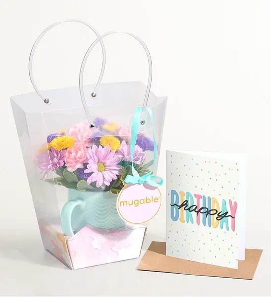 Mugable - Our florists design a one-of-a-kind arrangement in a mug,  with daisy, button and mini carnation
