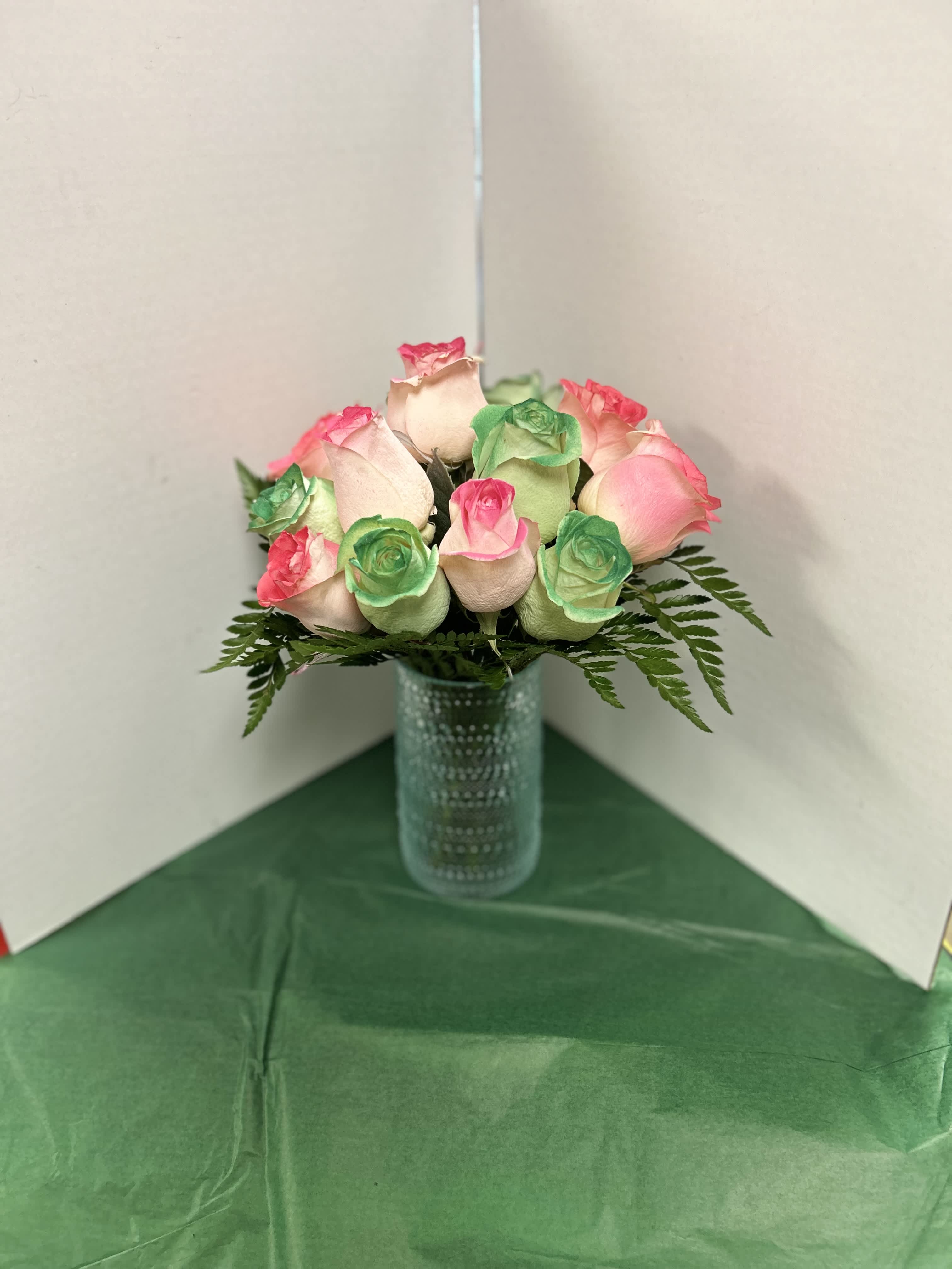 Perfect Pastels - 12 green, light pink, and coral roses that are arranged to bring a smile to anyone's face.