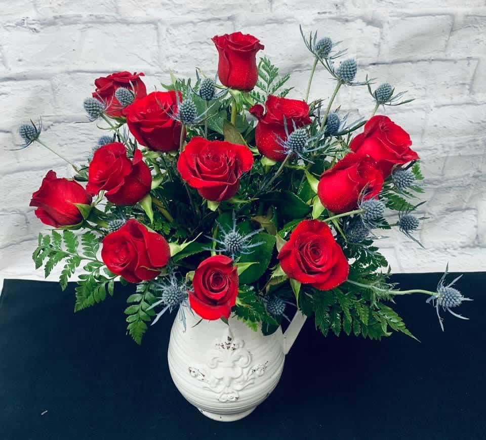 Dozen Rose Bouquet - Dozen Rose Bouquet is a classic expression of love and sweet affection! A bouquet of red roses arrive accented with lush greens all beautifully arranged in a clear glass vase.