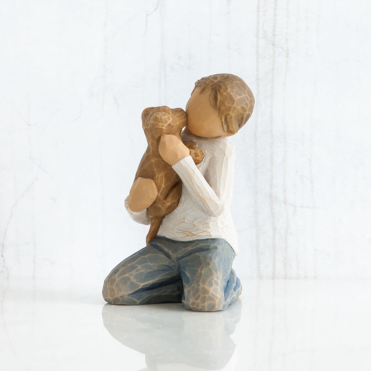 WILLOW TREE - KINDNESS BOY - Child figures work well in Family Groupings. Position two (or three or more) figures so that they appear to be interacting, turned toward one another, touching. Like families do. Designer's Susan Lordi carved, figurative sculpture. Hand-painted resin figure  Dust with soft cloth or soft brush. Avoid water or cleaning solvents