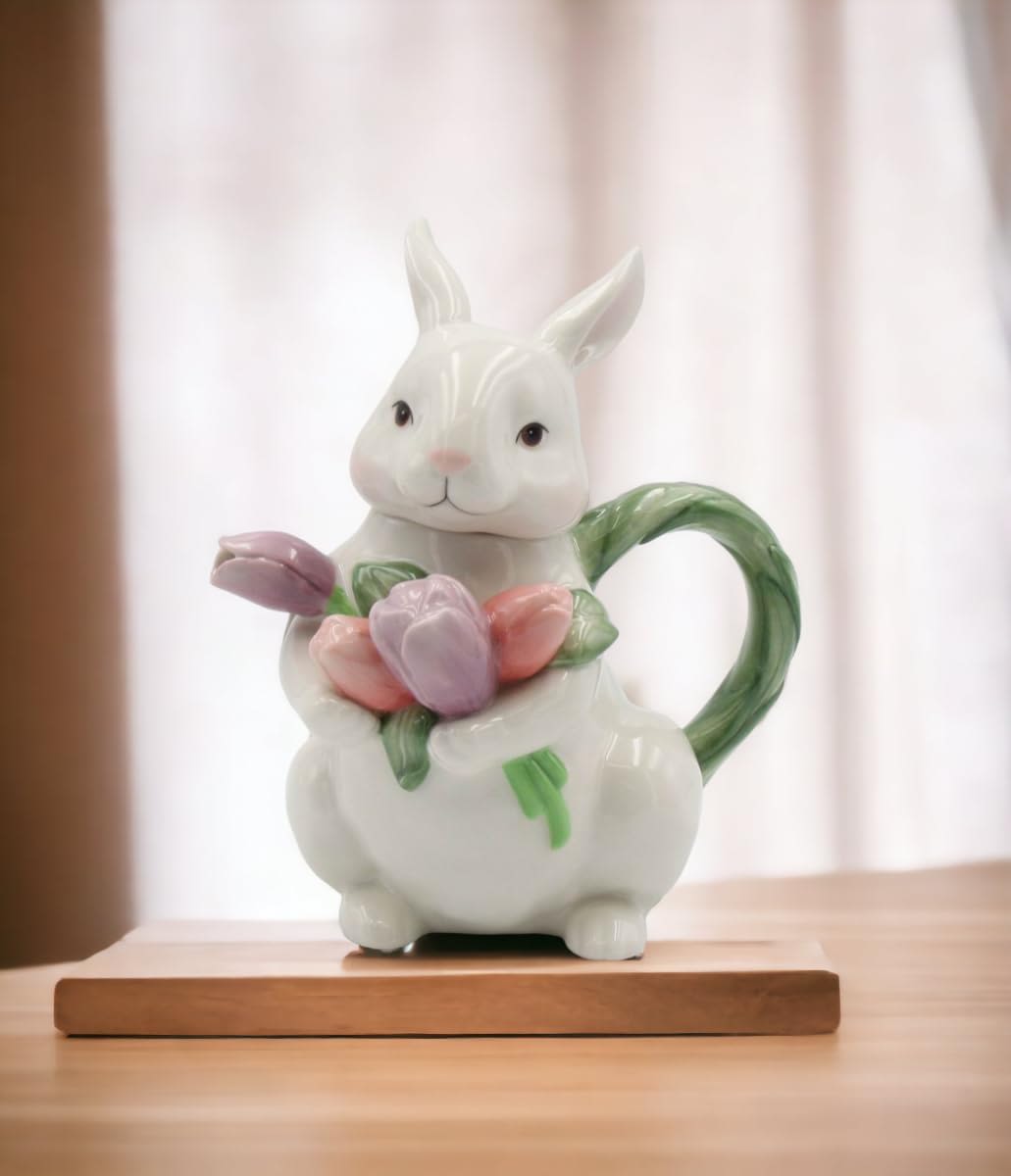 Ceramic rabbit figurine holding pastel tulips