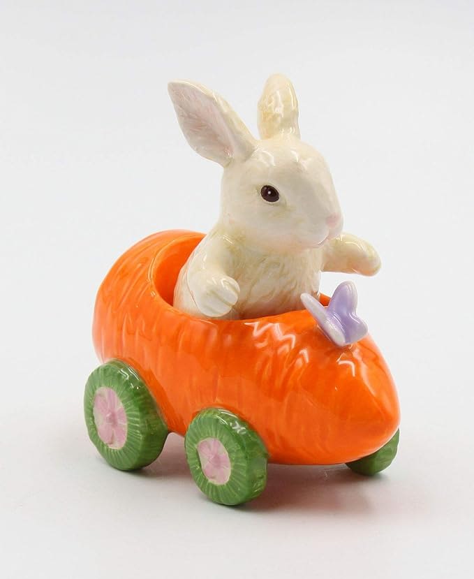 Ceramic bunny in an orange carrot-shaped cart with green wheels