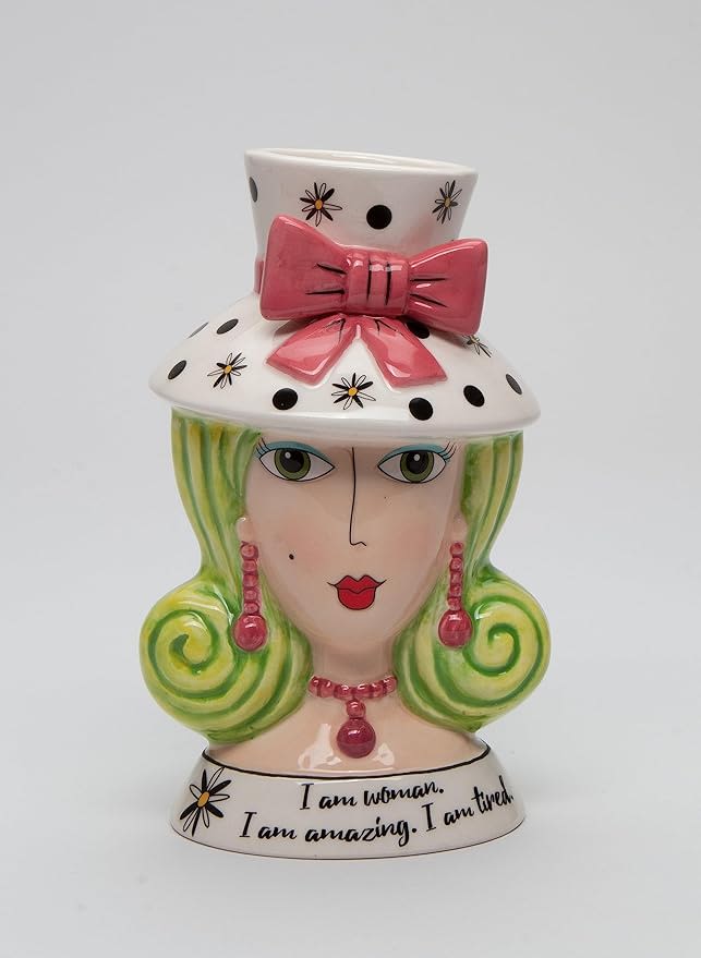 Decorative ceramic bust vase with a pink bow and painted face