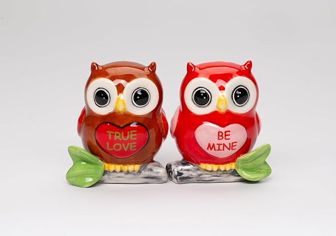 Two owl figurines with heart messages, one brown and one red