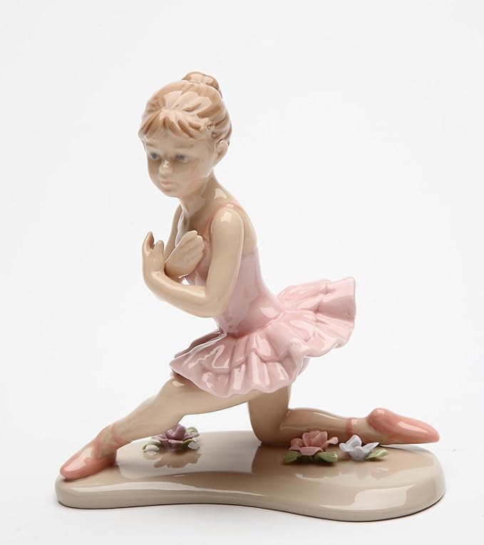 Porcelain ballerina figurine in a pink tutu on a small base