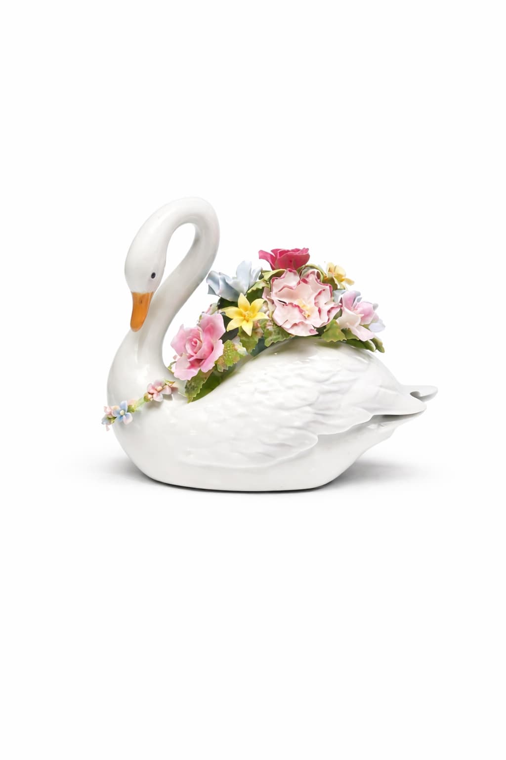 White ceramic swan figurine decorated with pastel sculpted flowers on its back and neck.