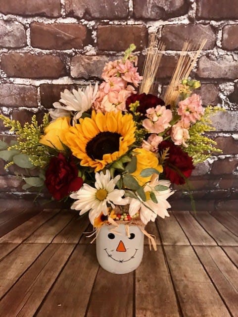 Scarecrow Smiles - An adorable scarecrow mason jar filled with beautiful fall flowers. Send a scarecrow smile today! Approx.10" W x 16" H